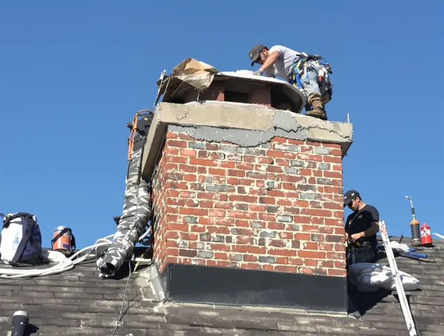 Lakewood Chimney Sweep installing a custom chimney crown in Lakewood, CA