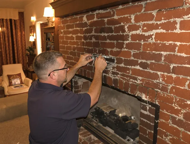 Lakewood Chimney Sweep expert fixing a fireplace in Lakewood, CA
